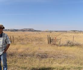CREWS lead Rob Walker stands in front of a field in the Powder River Basin