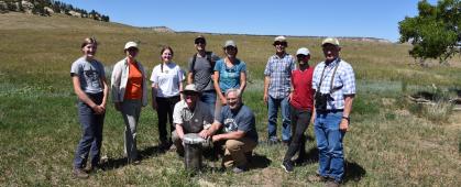 The CREWS-PRB team poses in front of a groundwater well