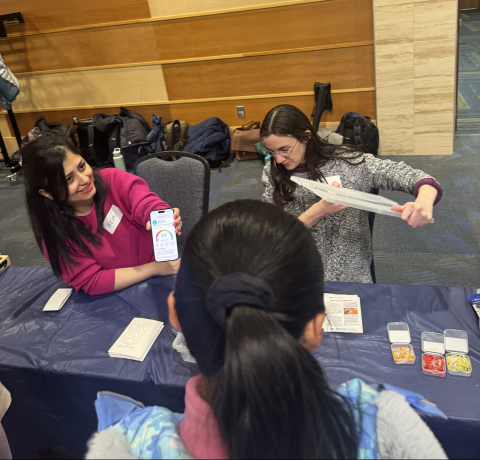 Graduate Students Azin Rashed and Mary Farina demonstrate air quality monitoring to fifth graders