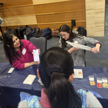 Graduate Students Azin Rashed and Mary Farina demonstrate air quality monitoring to fifth graders