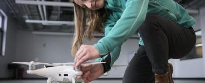 Shannon Hamp with a drone in Norm Asbjornson Hall on April 13, 2023. MSU Photo by Colter Peterson