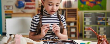 Girl holding matchbox car